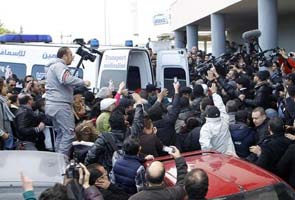 Tunisia protests after government critic shot dead