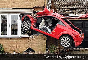 Man seriously hurt as crash leaves Audi embedded in UK home