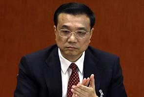 China's new premier pledges reform, sees risks