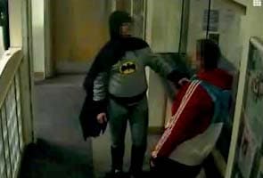'Batman' hands suspect over to UK police 
