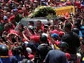 Hugo Chavez's body brought 'home' to military academy