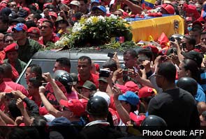 Hugo Chavez's body brought 'home' to military academy 