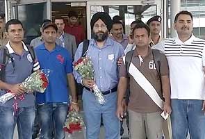Indian sailors, held captive by Somali pirates for a year, return home