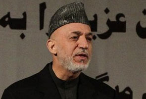 Hamid Karzai heads to Qatar to discuss Taliban peace talks