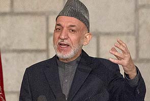 Hamid Karzai meets Qatari emir, on Taliban talks trip