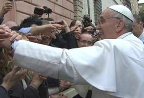 Pope tests his security detail by wading into crowd