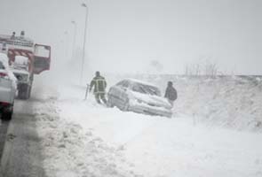 Unseasonable blizzards strand British motorists