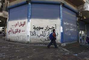 From teenage graffiti to a country in ruins: Syria's two years of rebellion
