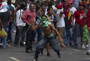 Venezuelan police fire tear gas during clash ahead of vote