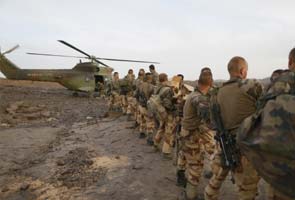 France looks to cut armed forces but keep military clout