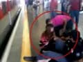 Watch: Girl's last-second rescue from a speeding train