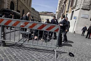 Two police officers shot as Italian government sworn in