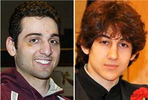 Boston bomb suspect drove over brother to escape gunbattle: police