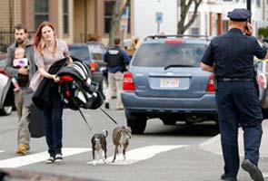 In Boston, trains and buses halted, planes flying