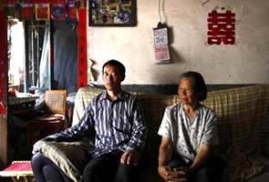 China dissident's brother says home attacked with dead poultry, bottles