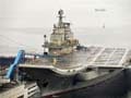China to build second, larger carrier for fighter jets: report