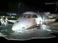 US: Plane lands on belly after landing gear fails