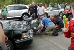 Up to 60 injured after car drives into US parade