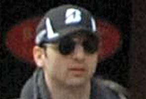 Boston Marathon bombing suspect died of gunshots, trauma: reports