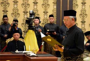 Najib Razak sworn-in as Malaysia's PM, opposition cries foul