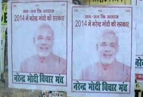 BJP workers put posters of Narendra Modi as PM during Nitish Kumar's Bihar tour