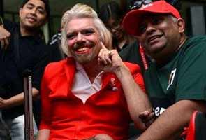 Richard Branson dresses up as air hostess after losing bet Richard Branson dresses up as air hostess after losing bet