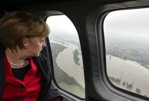 Chancellor Angela Merkel promises cash to German flood victims