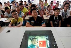 China astronauts give classroom lecture to students from space 