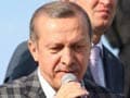 Turkey PM Recep Erdogan climbs on bus, slams protesters