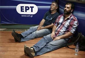 Greece back in crisis mode on state TV shutdown, downgrade