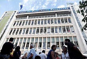 Greek workers strike over shutdown of state broadcaster as backlash grows