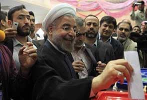 Iran elections: Moderate cleric Hassan Rohani wins presidential election in landslide