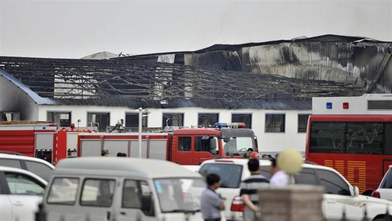 Relatives scuffle with police after China fire kills 120 people