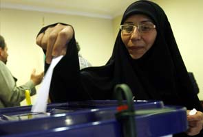 Iran votes out of duty, hope and obligation