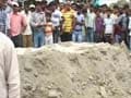 Outside Bihar school, a mass grave marks families' anger, grief