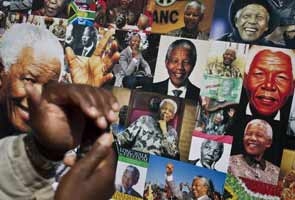 World pays tribute as "improving" Nelson Mandela turns 95