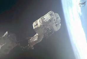 NASA aborts spacewalk after water leak in astronaut's helmet