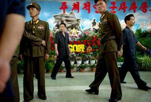 Guns, grenades and rockets at North Korea flower show