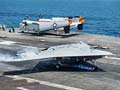 US drone X-47B lands on carrier deck in historic flight