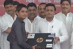 Akhilesh Yadav distributes free laptops in Lucknow