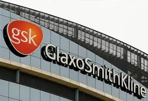 China bars GlaxoSmithKline executive from leaving country amid bribery probe