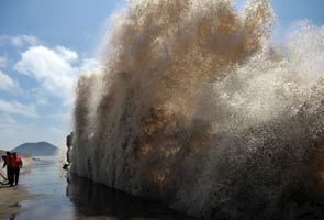 Nearly 300 dead or missing in China rain, typhoon