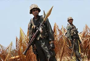 Sri Lanka to reduce troops in northern war zone ahead of polls