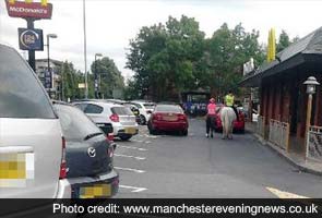Denied service in drive-through kiosk, woman enters McDonald's in London on horseback