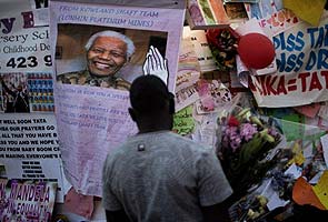 Nelson Mandela's wife says she is now 'less anxious' about his health