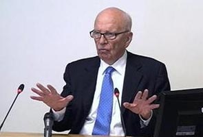 On tape, Rupert Murdoch slams police investigation 