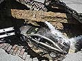 Ohio sinkhole swallows car; driver climbs ladder