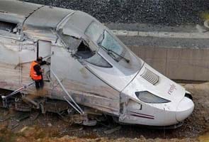 Spain's train driver was talking to ticket inspector on phone when it crashed