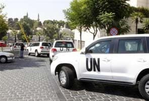 Syria: UN inspectors come under fire, Washington warns Assad