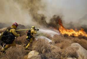 California wildfire injures five, causes 1,800 to flee homes